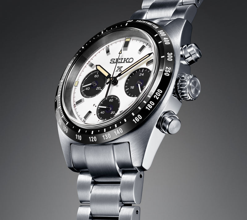 Seiko chronograph wristwatch with a silver dial and black bezel.