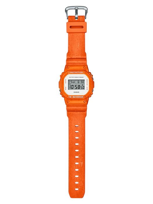 Orange digital wristwatch with a square face and rubber strap.