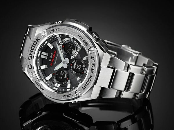 Stainless steel G-Shock wristwatch with a complex chronograph dial and metal bracelet.