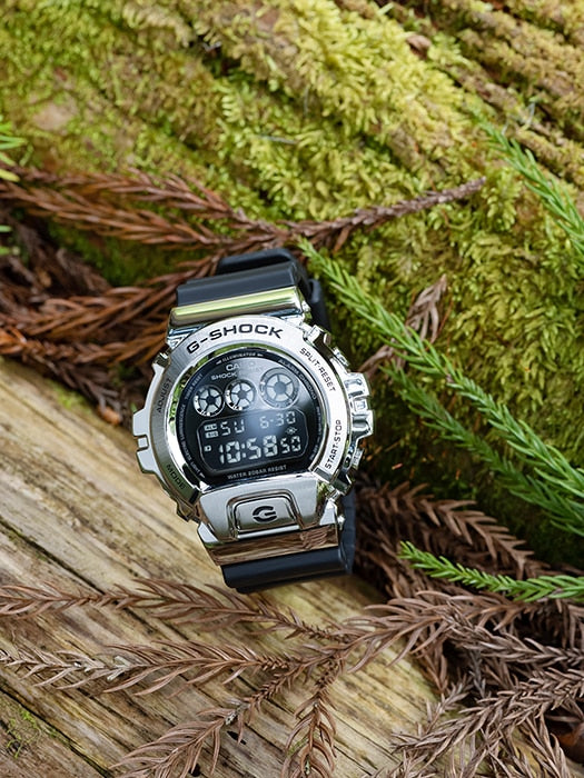 G-Shock digital wristwatch with a metallic silver case and black band.