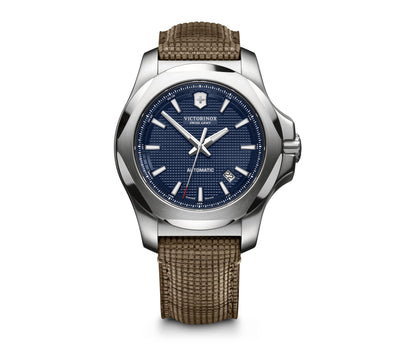 Luxury wristwatch with a blue dial and brown leather strap.