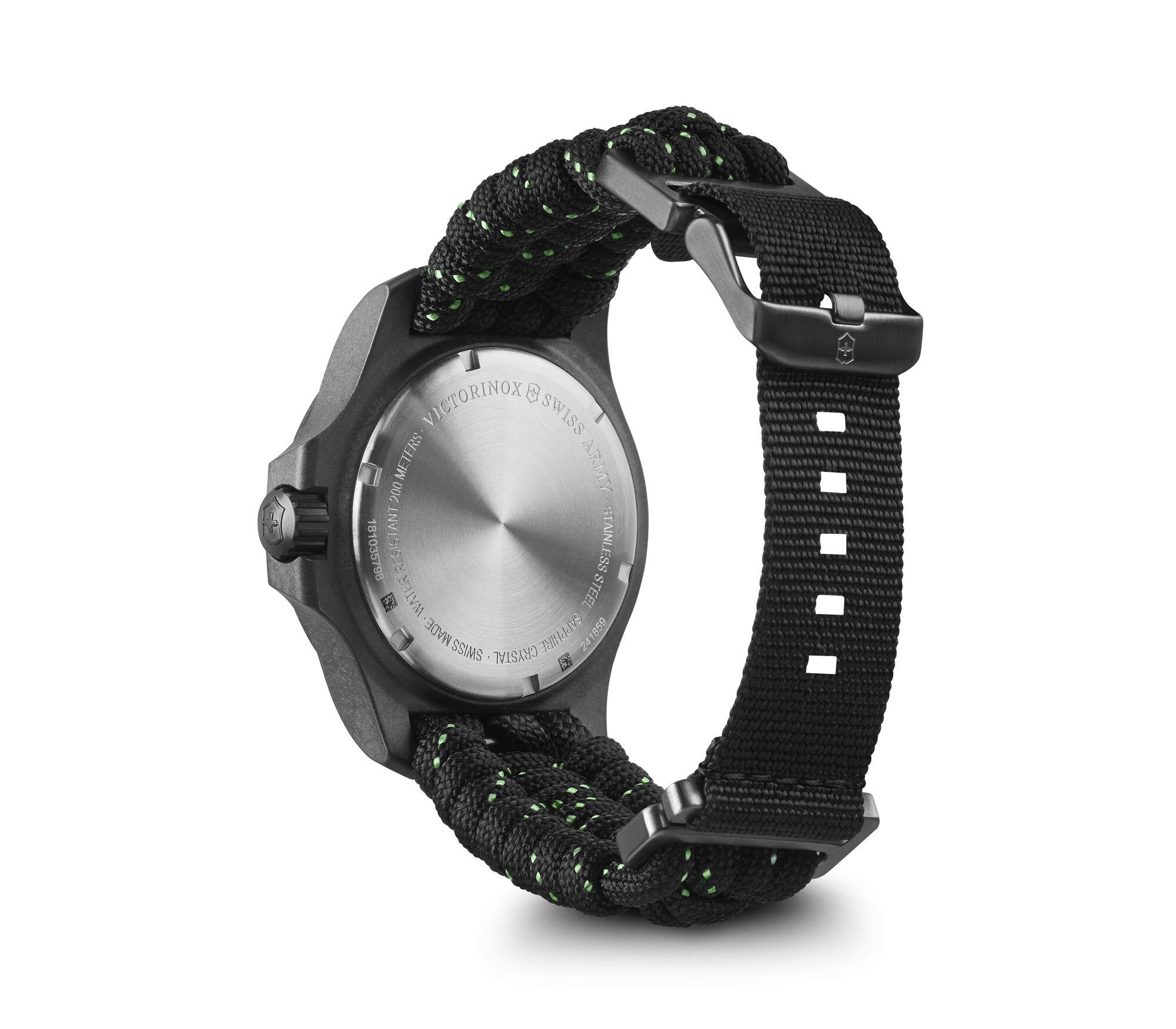 Wristwatch with a black fabric strap and silver dial face.
