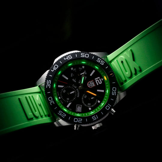 Stylish sports watch with a black face and bright green accents on the bezel and strap.