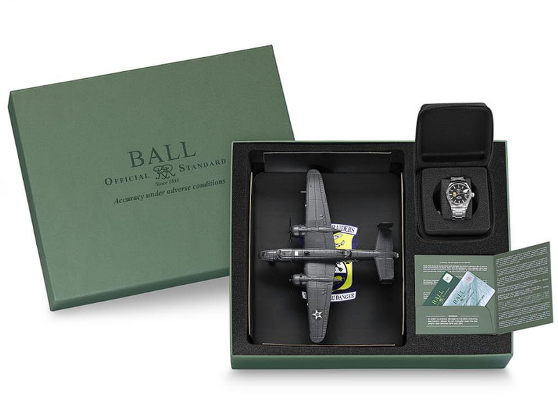 Gift set featuring a model airplane, watch, and packaging.