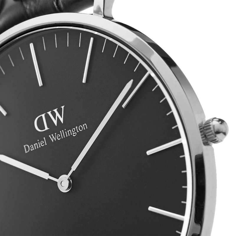 Sleek wristwatch with a black dial and silver case displaying the Daniel Wellington brand.