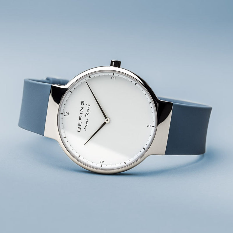 Sleek wristwatch with a white face and blue strap.