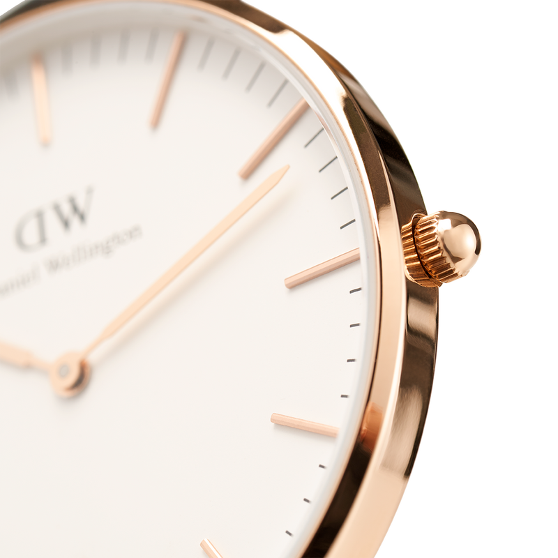 Elegant rose gold wristwatch with a minimalist white dial and slender hour markers.