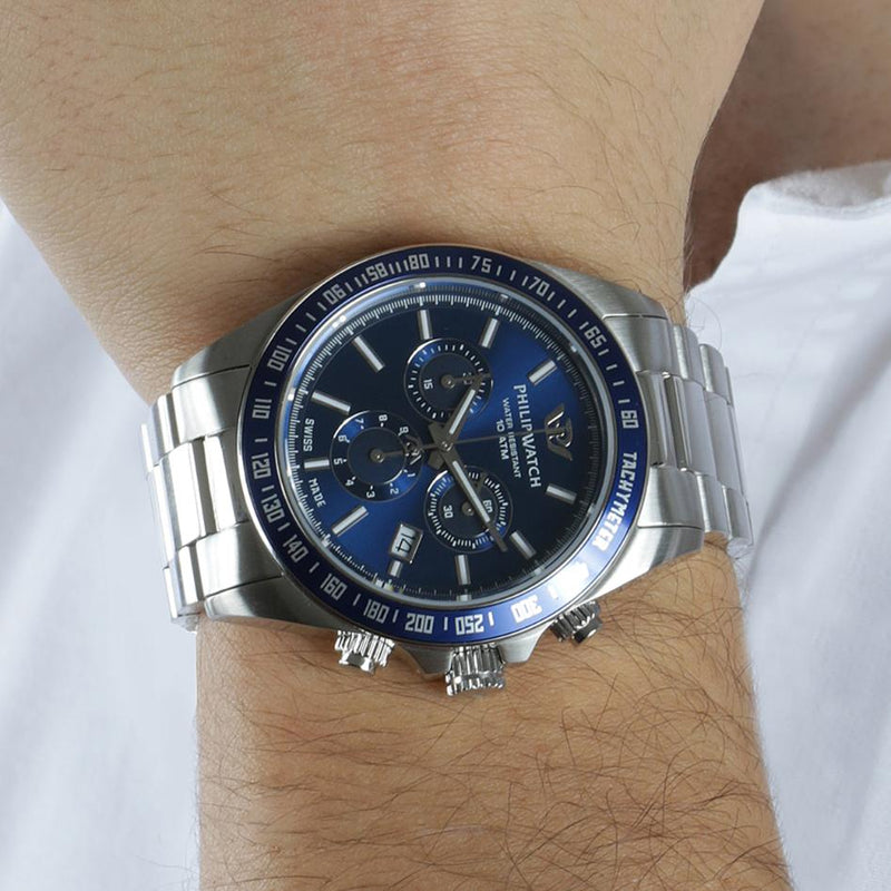 Stainless steel chronograph wristwatch with a blue dial and silver bracelet.