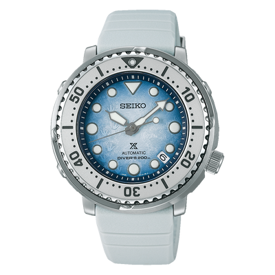 Seiko dive watch with a light blue dial and white rubber strap.