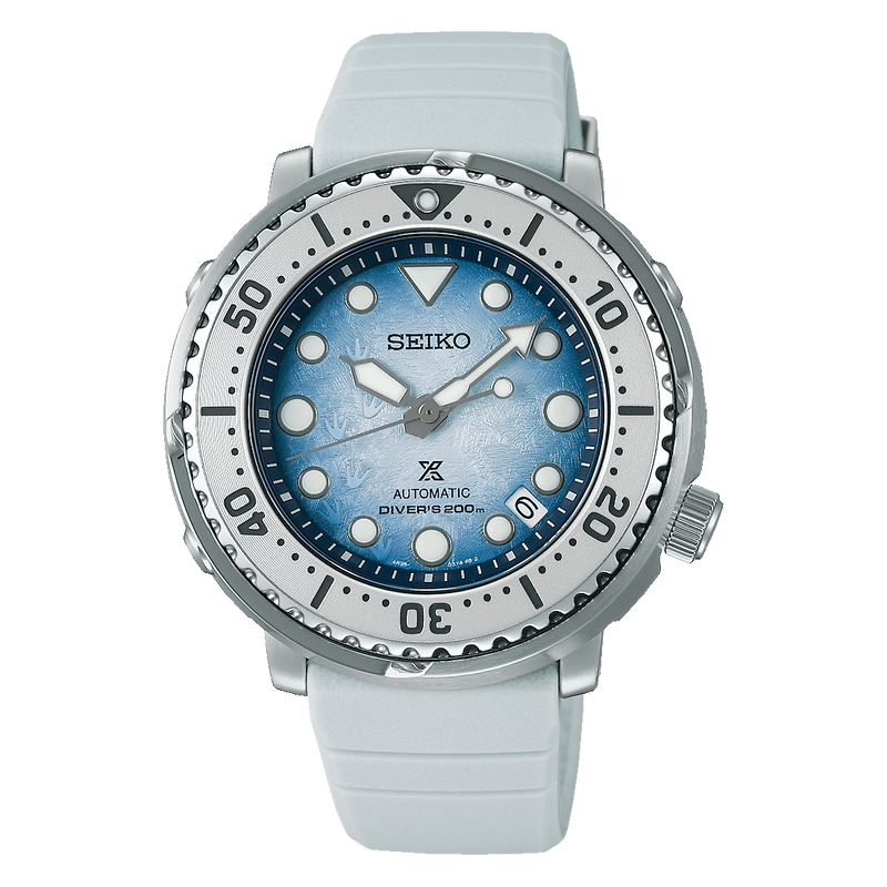 Seiko dive watch with a light blue dial and white rubber strap.